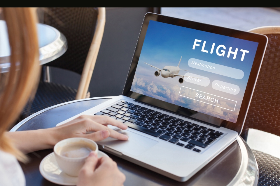laptop with the word flight and an airplane image on it